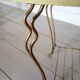 Table basse vintage en bois laqué et métal doré