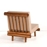 Pair of low chairs called La cachette selected by Charlotte Perriand