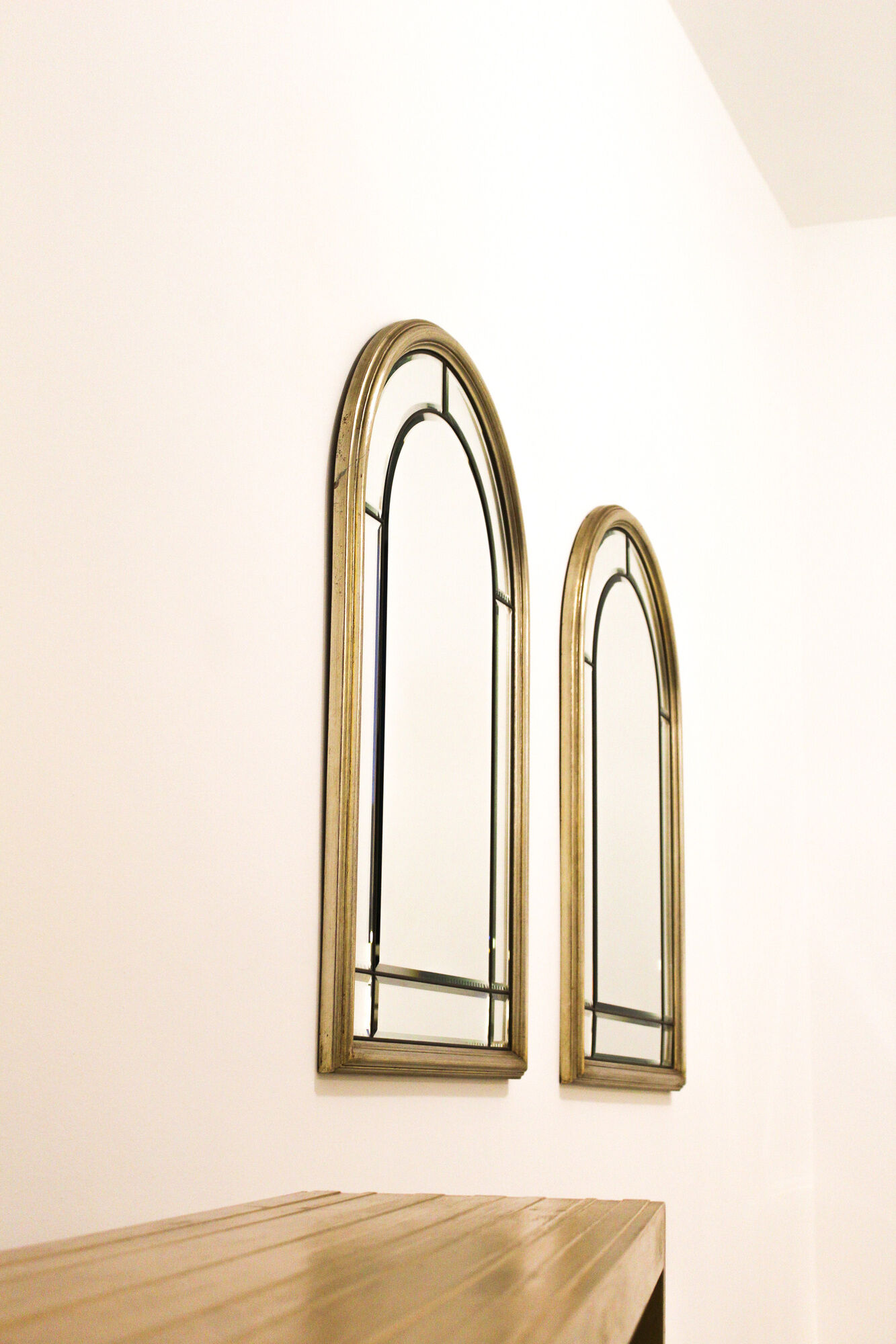 Pair of bevelled mirrors, brass edging frame in brushed wood years Italy 70's