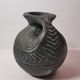 Vintage native american jug pot with geometric patterns in green / gray tones
