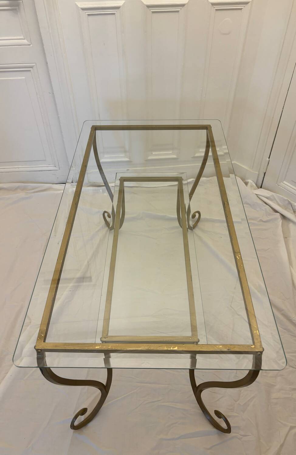 Large gold wrought iron and glass side table.