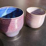Purple enamelled sandstone potduo signed
