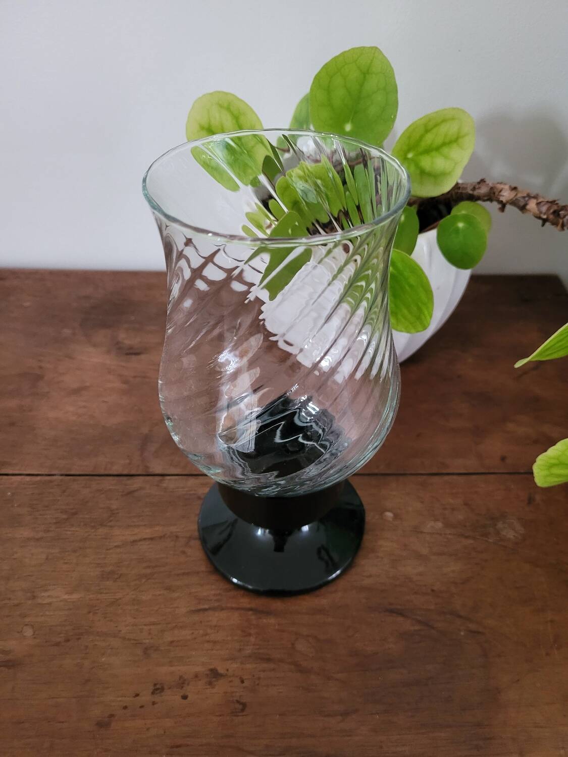 Glass candle holder with black base