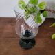 Glass candle holder with black base