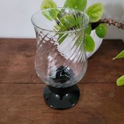 Glass candle holder with black base