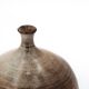 Ovoid vase with a small neck in brown beige ceramic and white drips.