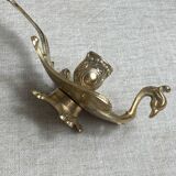 Bronze hand candlestick in the shape of a peacock