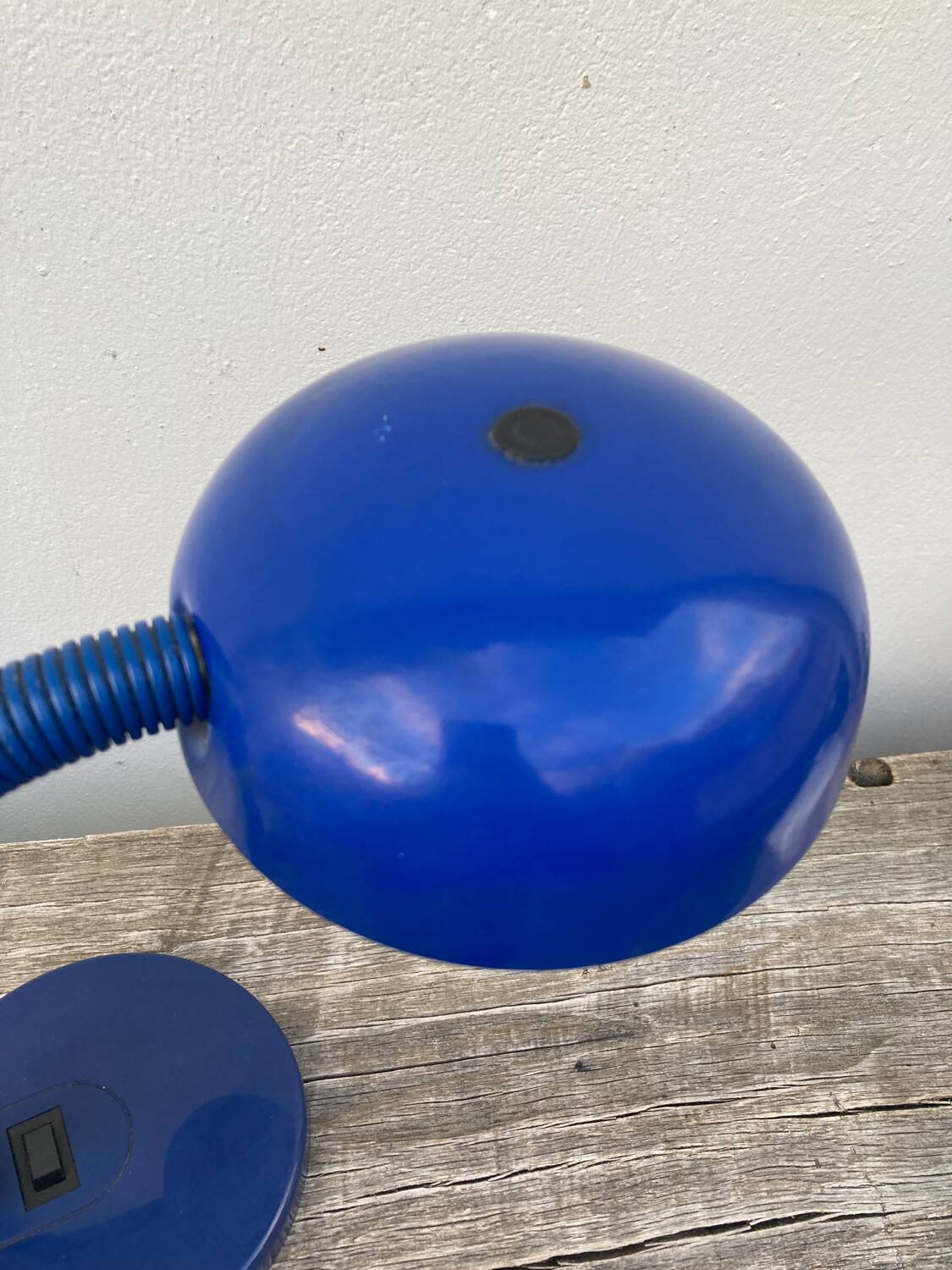 Articulated blue metal bedside lamp