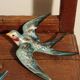 Set of two numbered vintage ceramic wall swallows