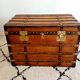 Restored varnished wooden antique travel trunk