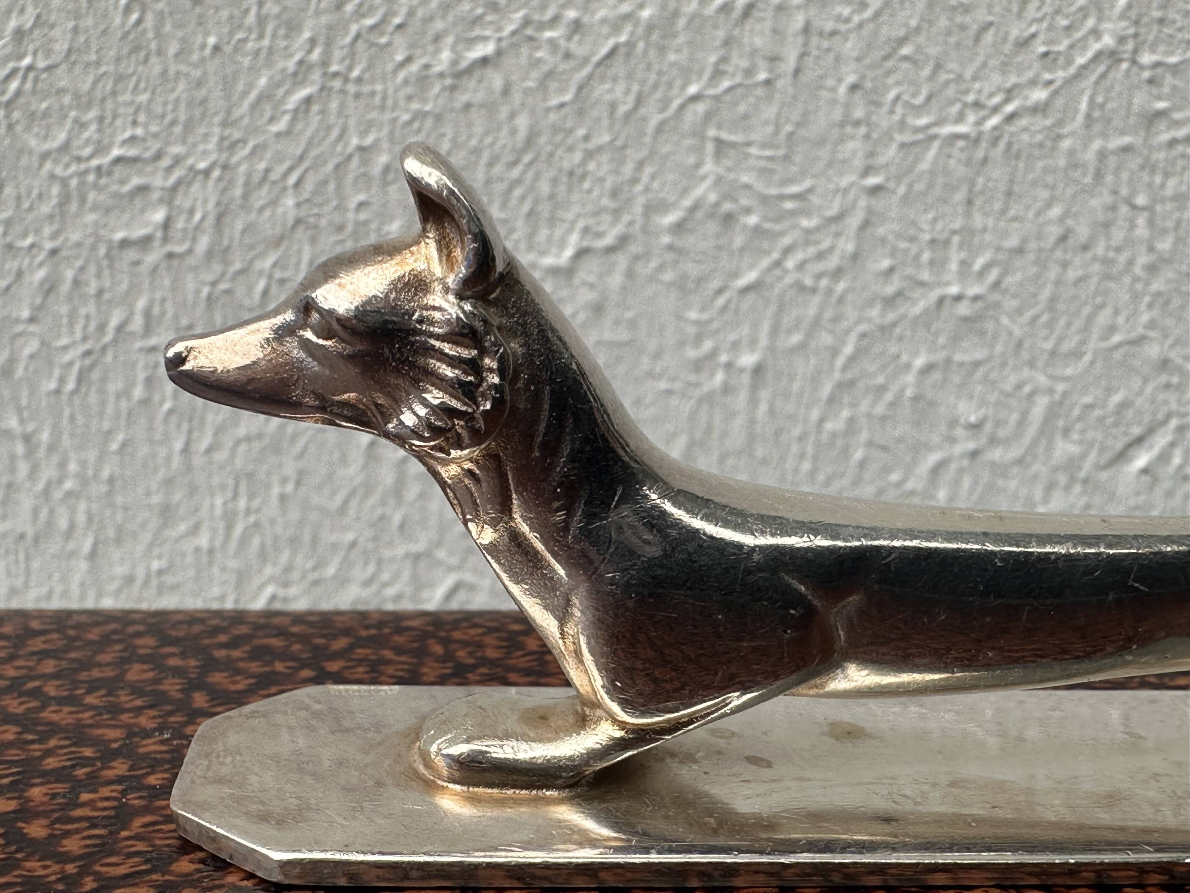 12 antique silver-plated bronze knife rests in modern art deco animal designs.