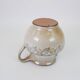 Glazed ceramic jug with plant decoration