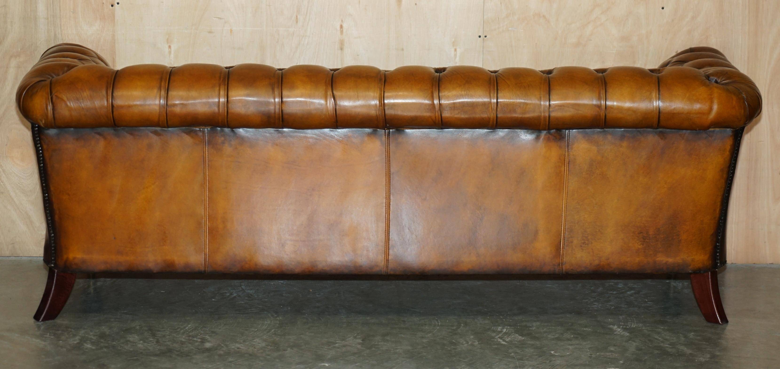 Vintage Chesterfield serpentine luxury sofa in restored leather