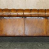 Vintage Chesterfield serpentine luxury sofa in restored leather