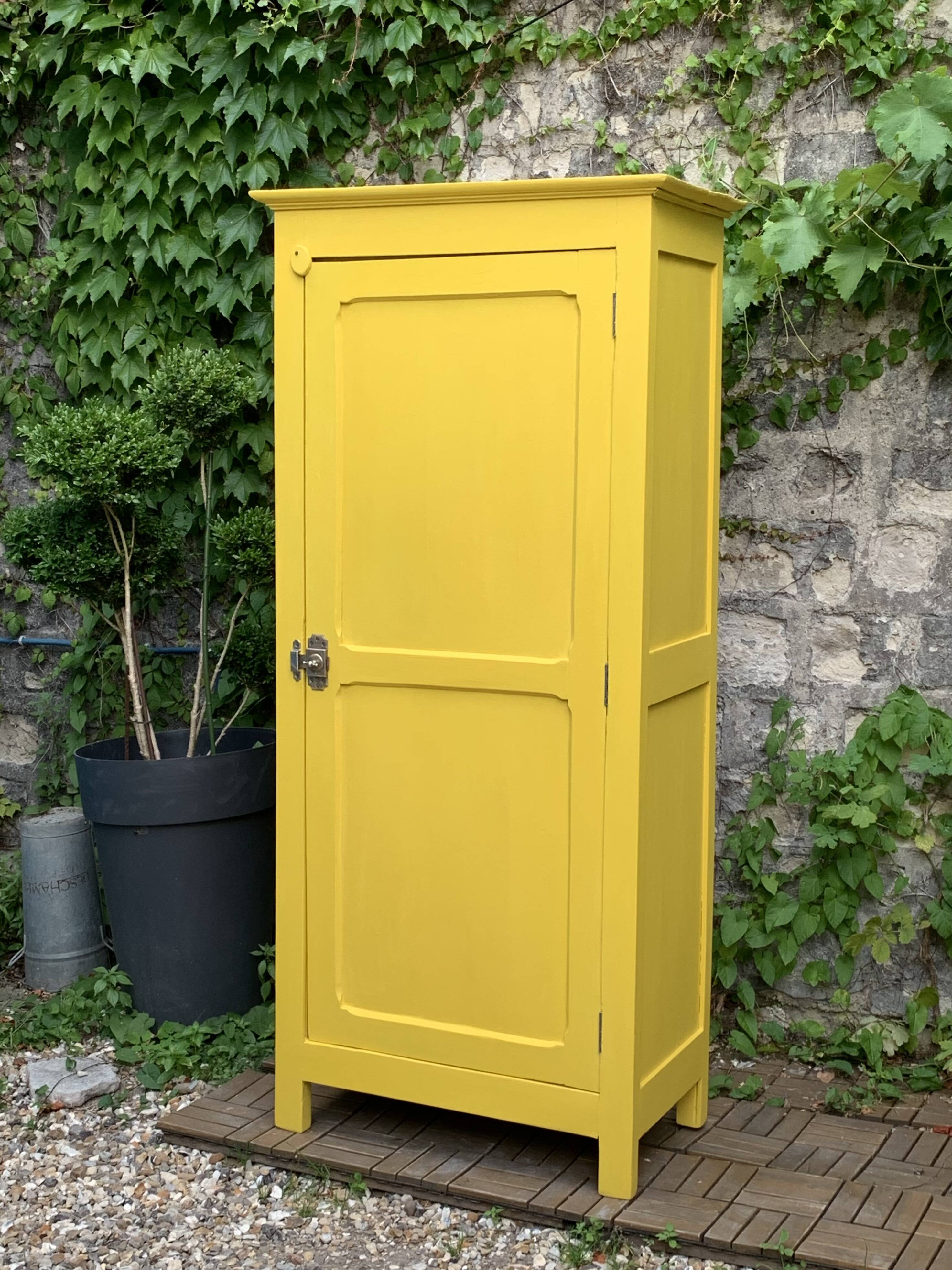 Antique powder yellow Parisian bonnetière wardrobe.