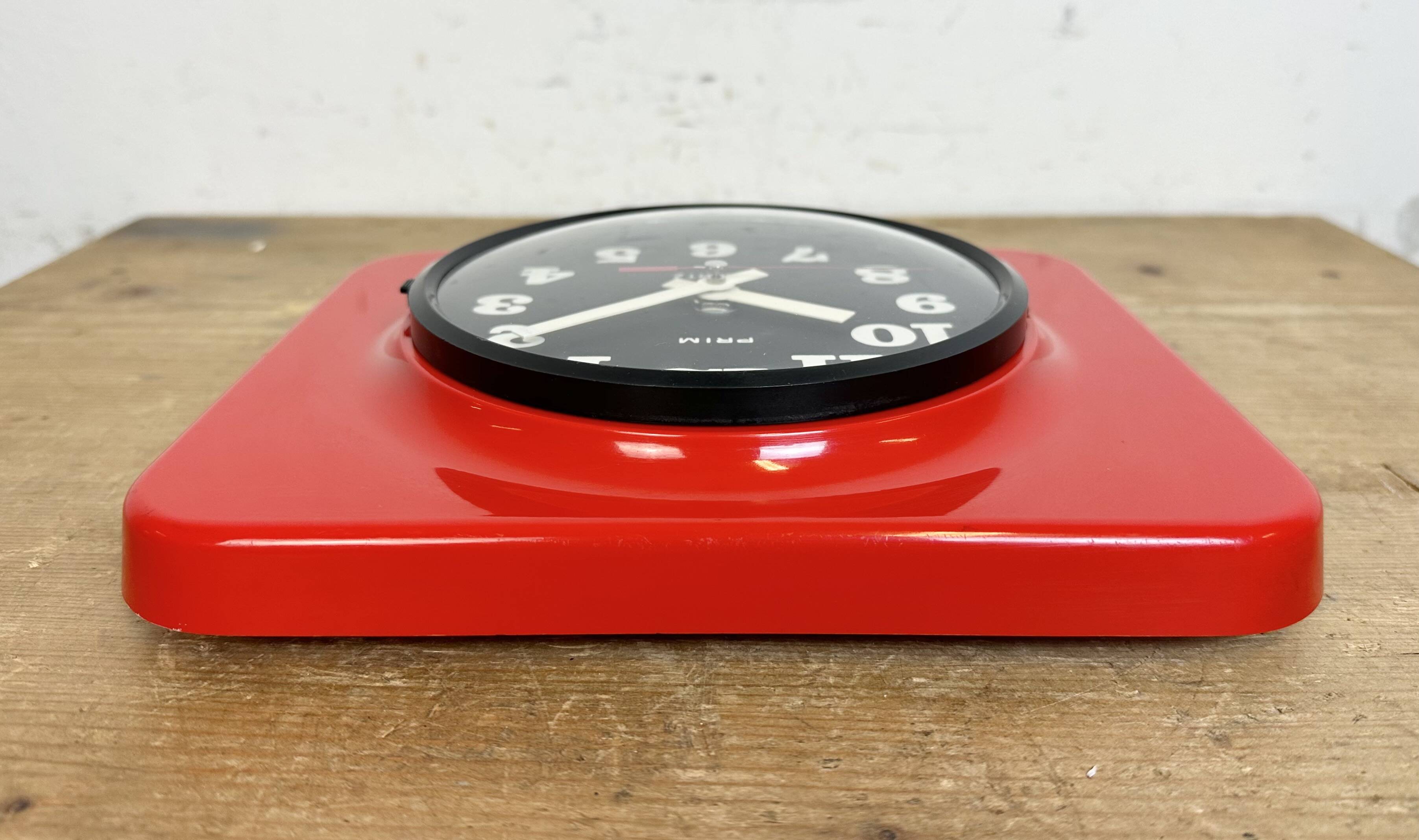 Vintage red bakelite wall clock from prim, 1970s