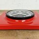Vintage red bakelite wall clock from prim, 1970s