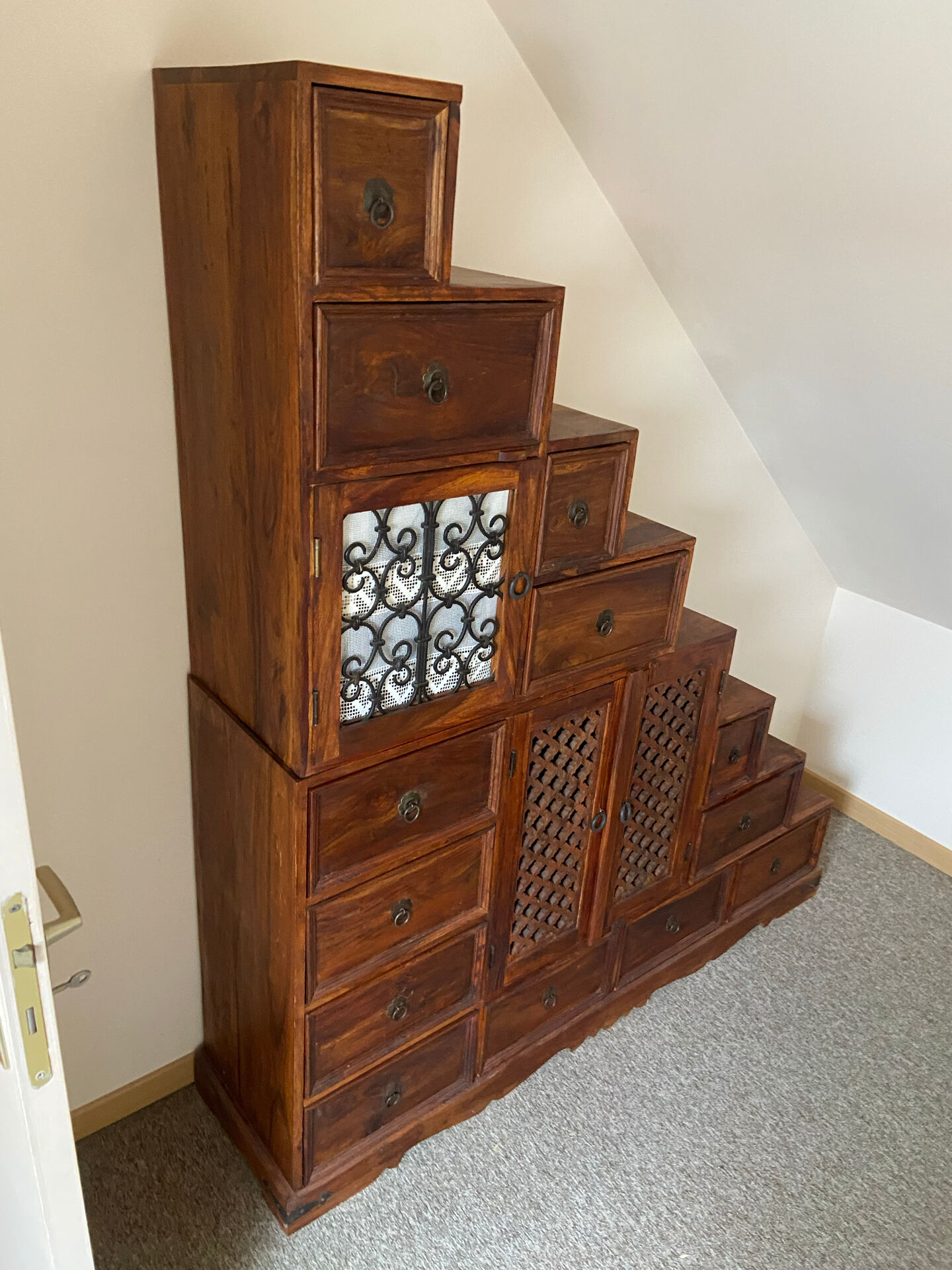 Indonesian staircase furniture in rosewood and wrought iron.