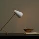 Mid Century adjustable table lamp with perforated shade from the 1950s.