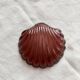 Vintage shell-shaped glass bowl in purple.