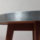 Vintage metal and teak side table from the 1950s.