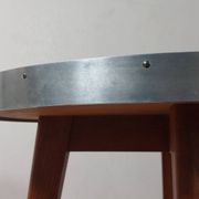 Vintage metal and teak side table from the 1950s.