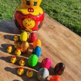 Chicken with eggs and chicks
