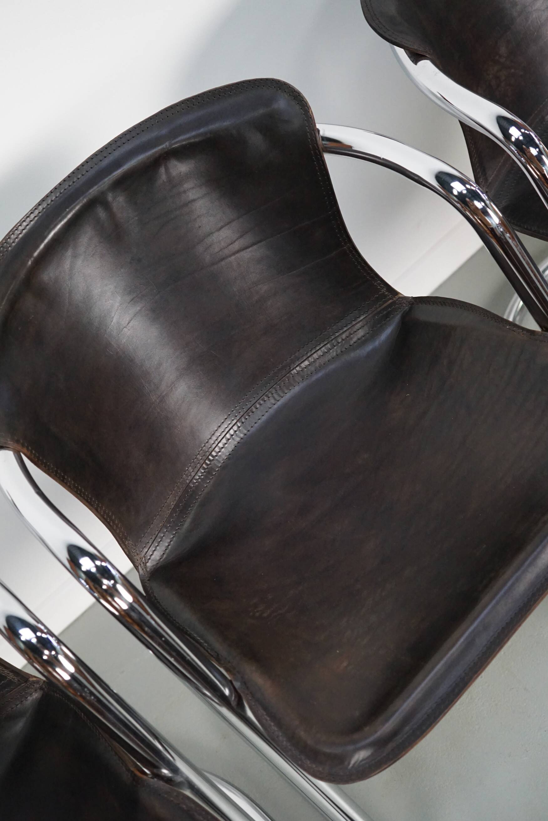 Set of four brown leather dining chairs, Willy Rizzo, 1970