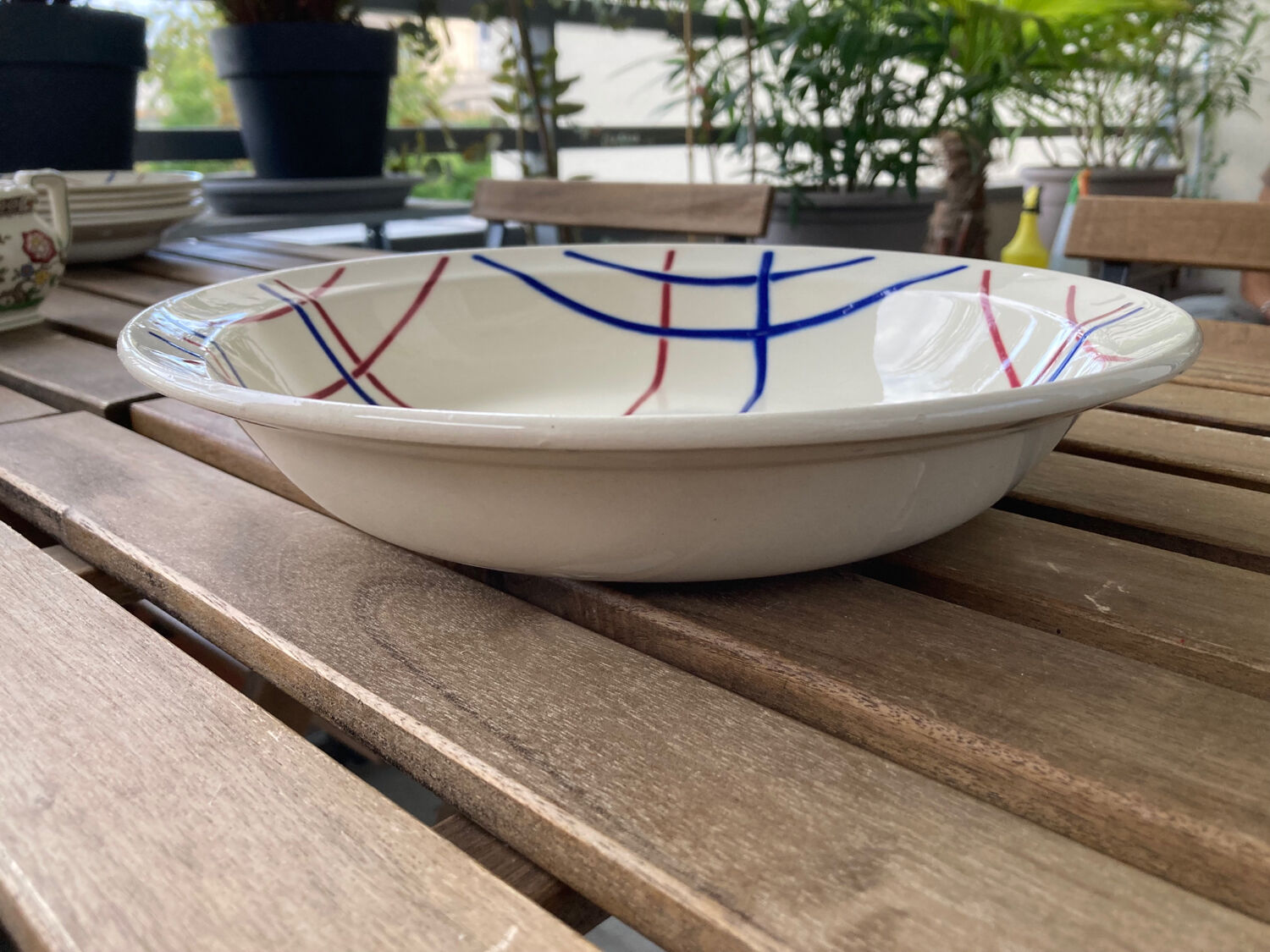 Antique Badonvillier round dish, red and blue intersecting lines