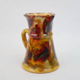 Beautiful ceramic pitcher in fire colors