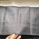 Old embroidered table napkin MA dark grey