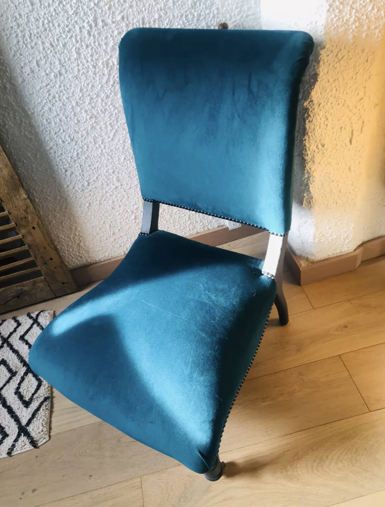 Velvet and studded armchair