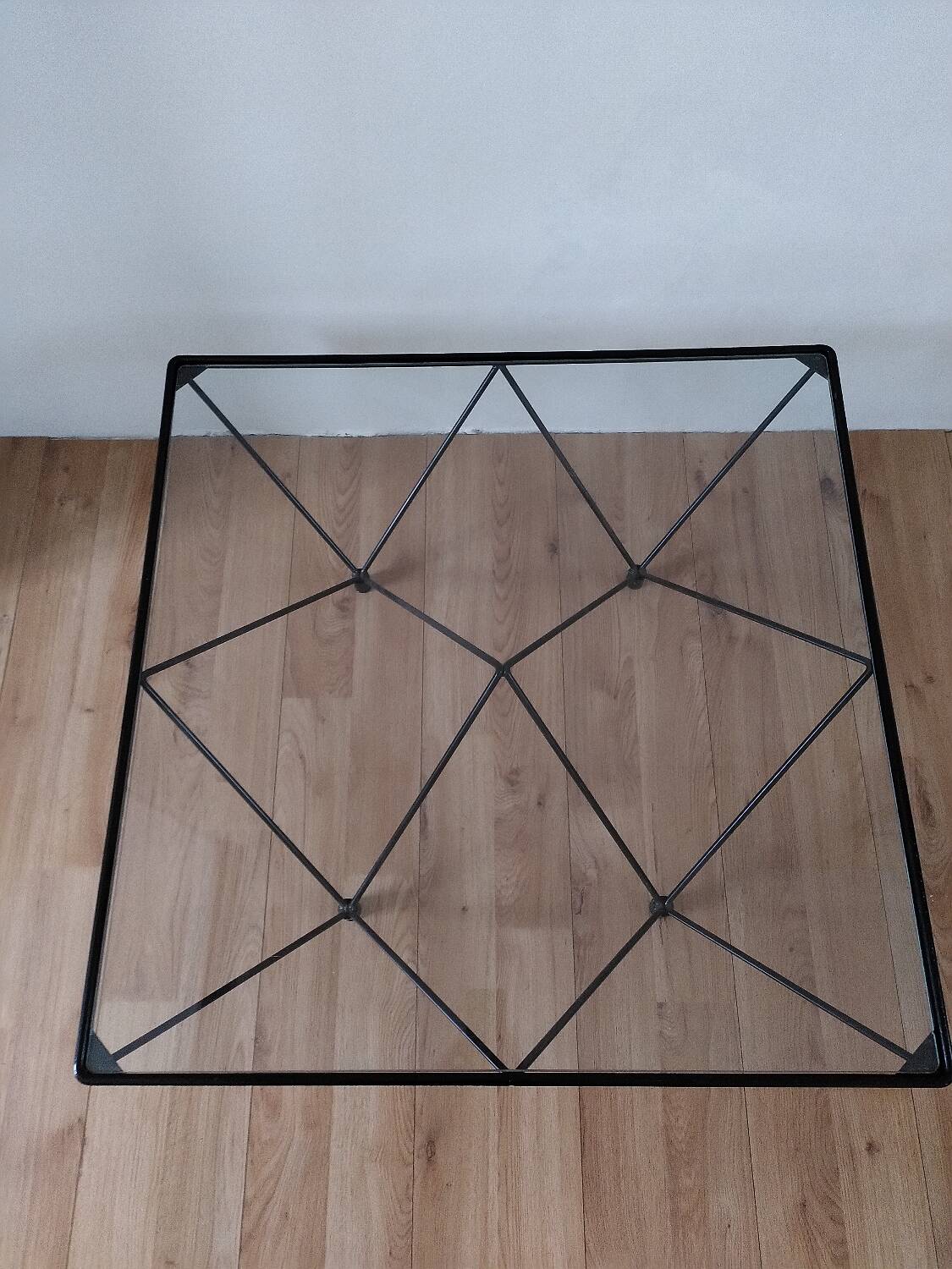 Glass coffee table with a metal frame.