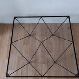Glass coffee table with a metal frame.