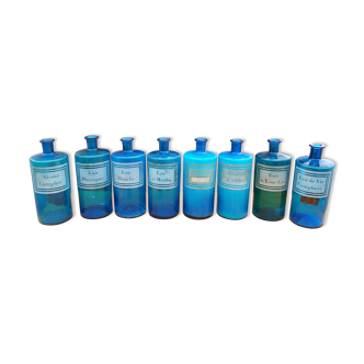 8 pharmacy bottles in blue glass screen-printed 19th