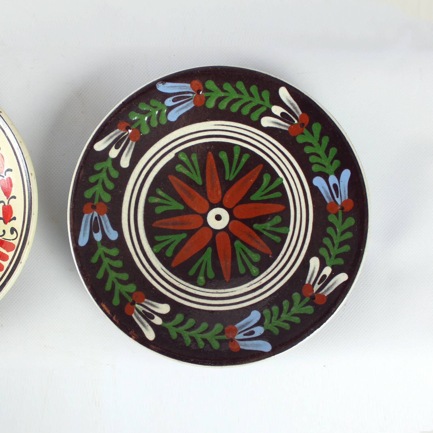 Set of three vintage folk art ceramic wall plates, Czechoslovakia and Romania.