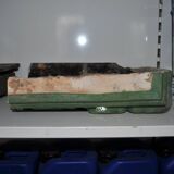 Green enamelled ceramic stove tile — finely sculpted Hungarian pattern from the late 19th century.