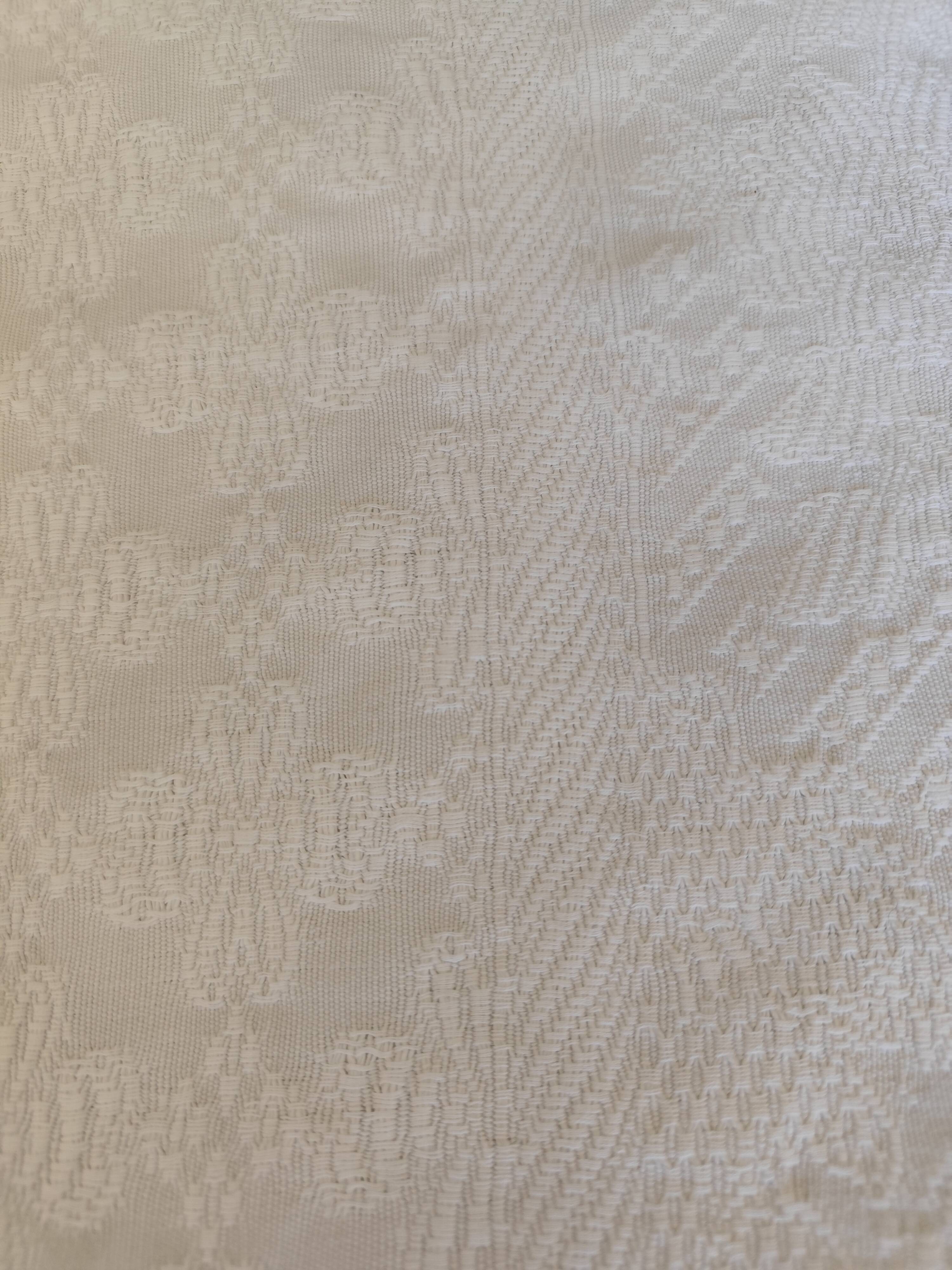 White woven cotton bedspread with fringes