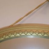 Oval mirror in wood and gilded plaster with pompom decoration
