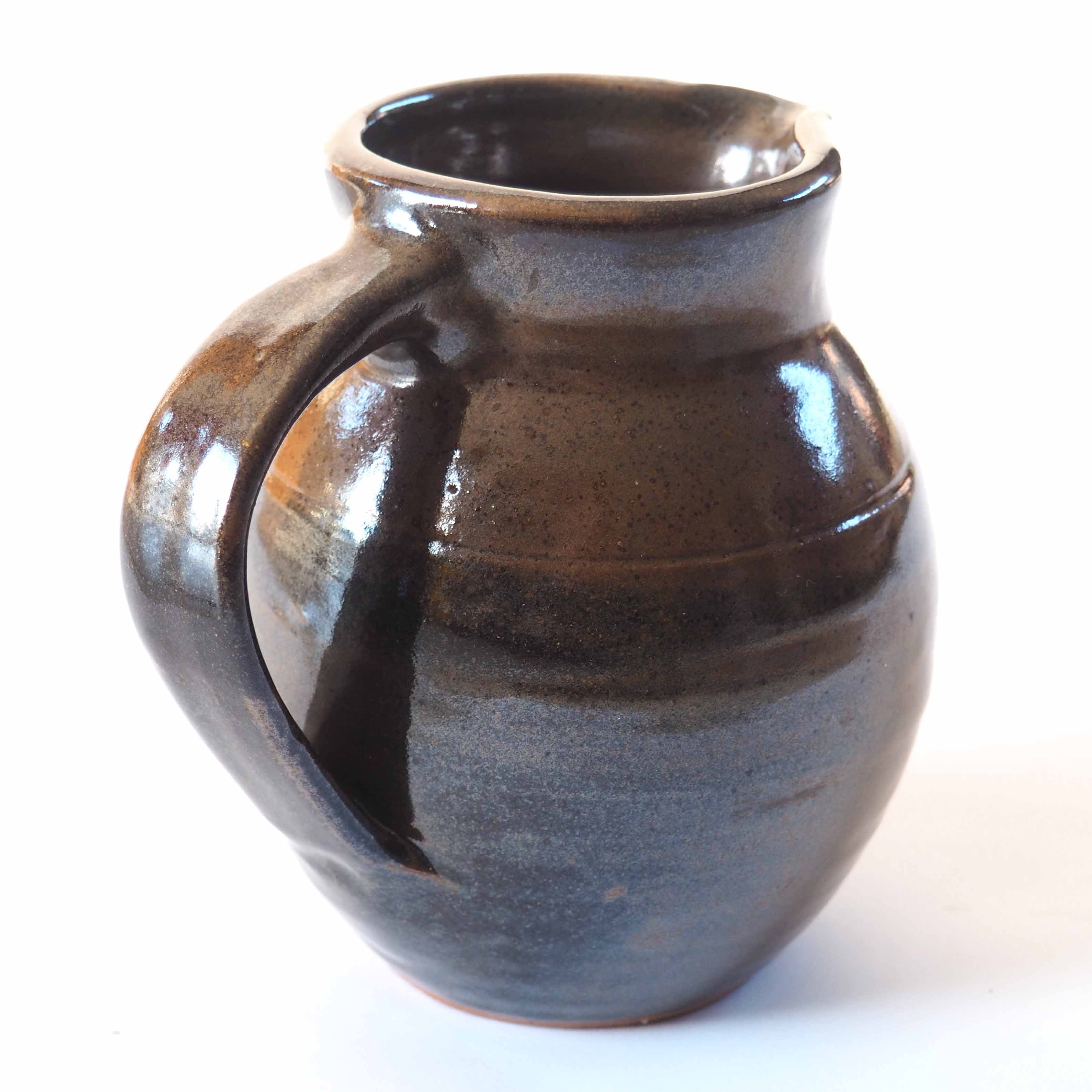 Duo of sandstone pitchers