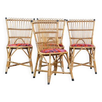 Set of 4 subtle and charming vintage 60s rattan boho chairs with colorful upholstered seats