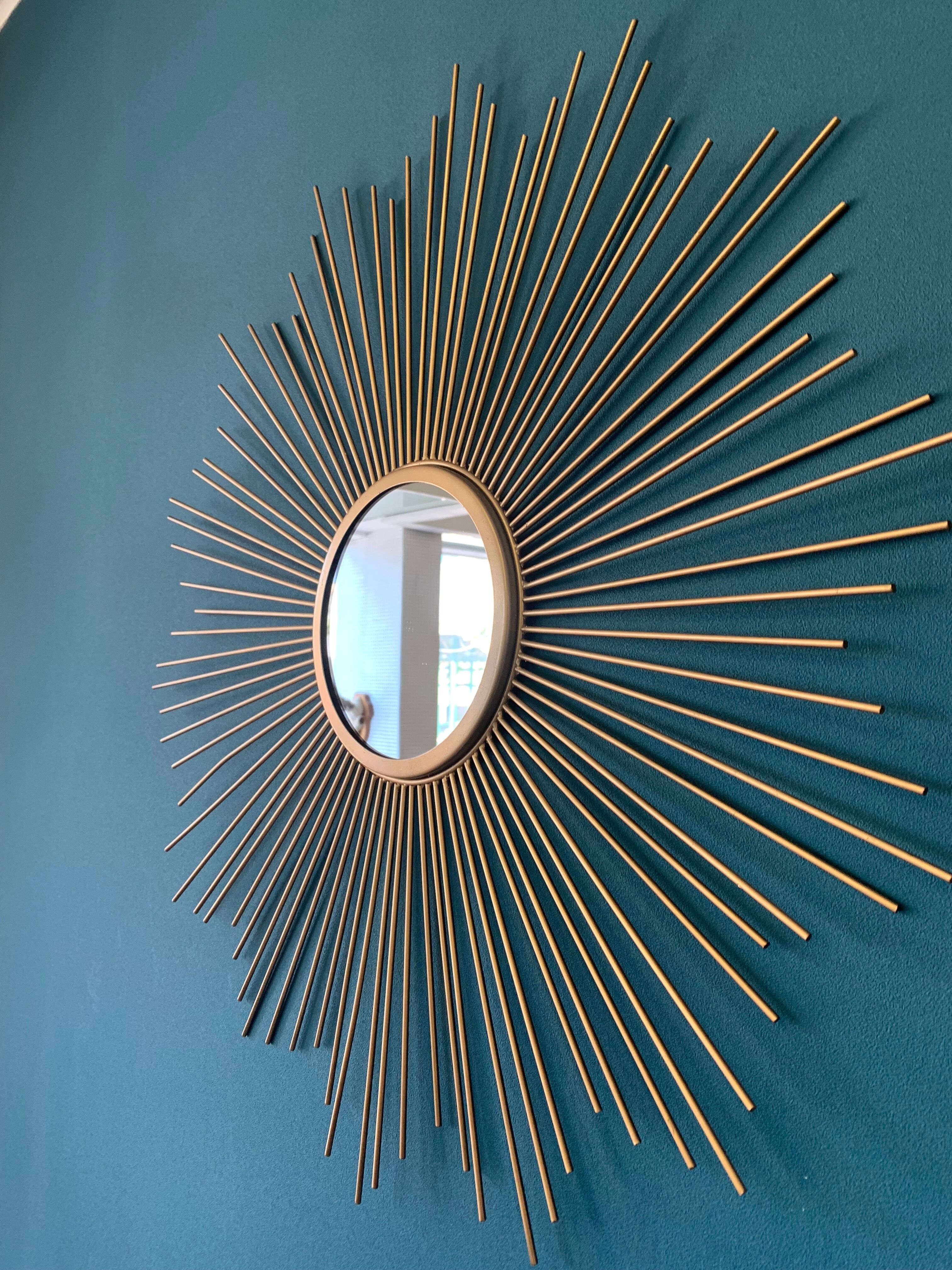 Sun mirror in gilded metal