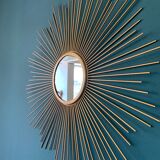 Sun mirror in gilded metal