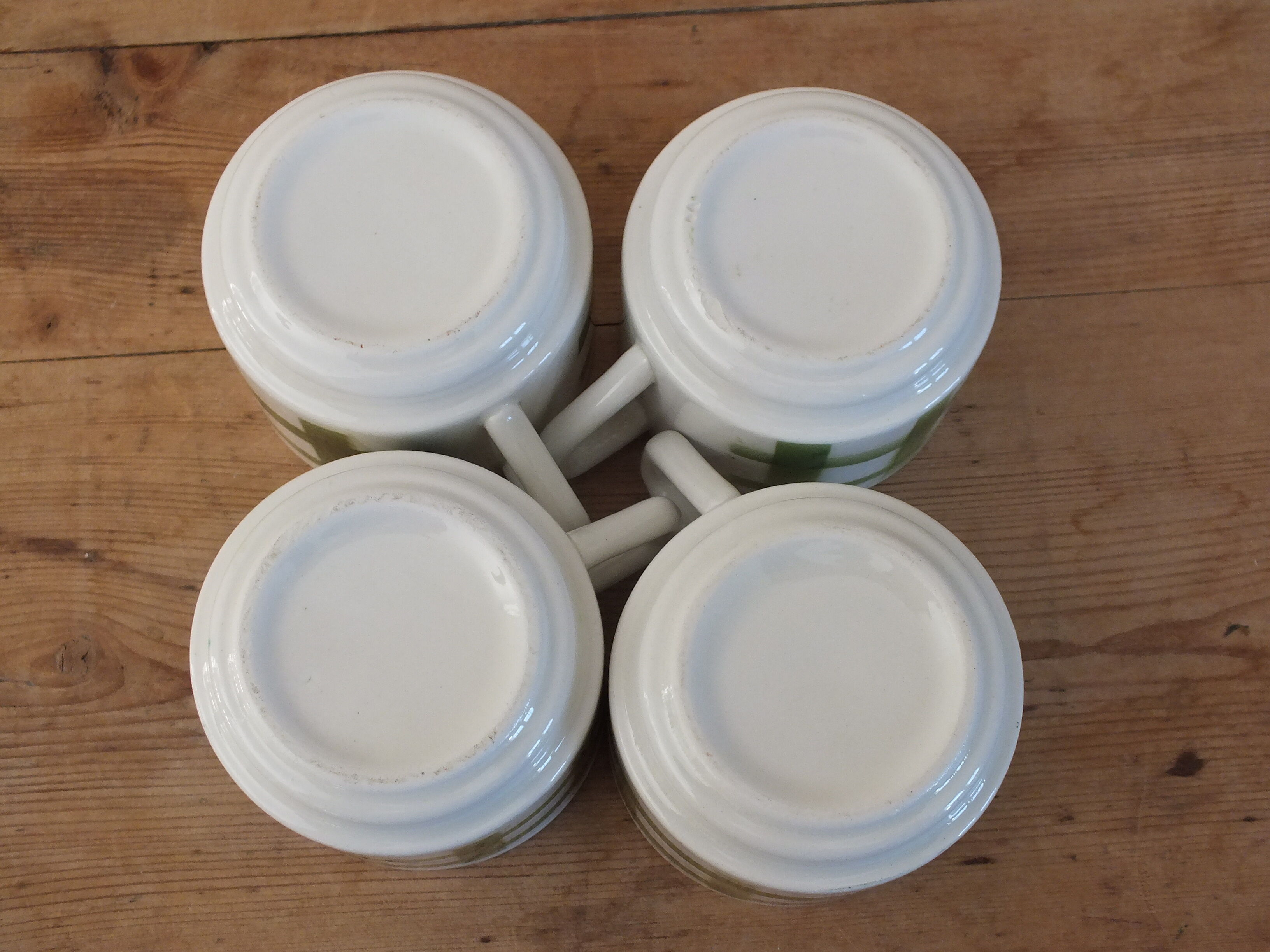 4 vintage cups with green tile decor