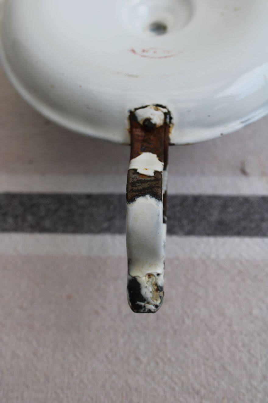 Antique enamel candle holder