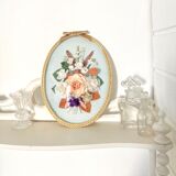 Frame domed glass flowers in fabric