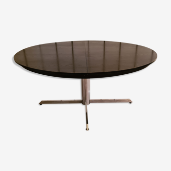 Blackened wooden dining table and chrome foot