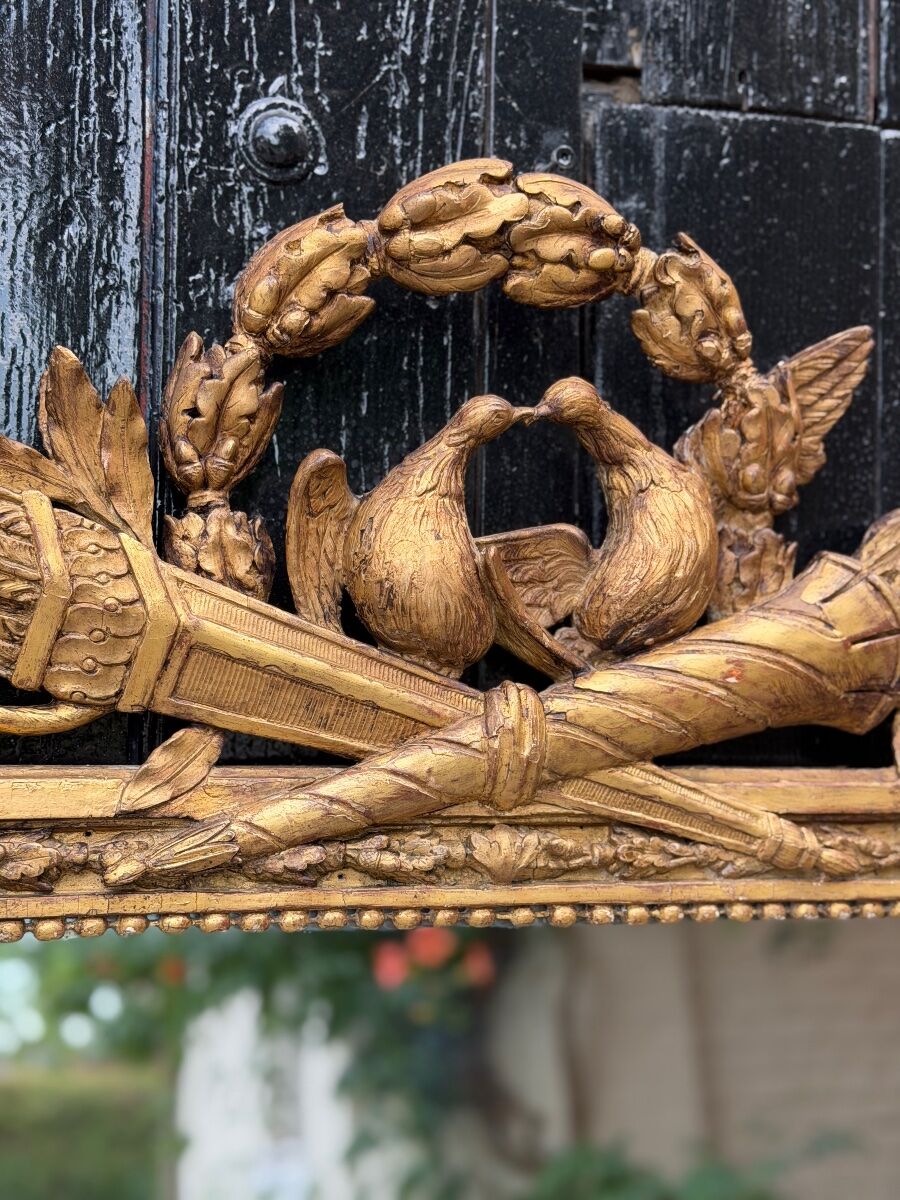 Louis XVI mirror in carved and gilded wood, 18th century