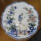 Ceramic dish with Chinese decorations