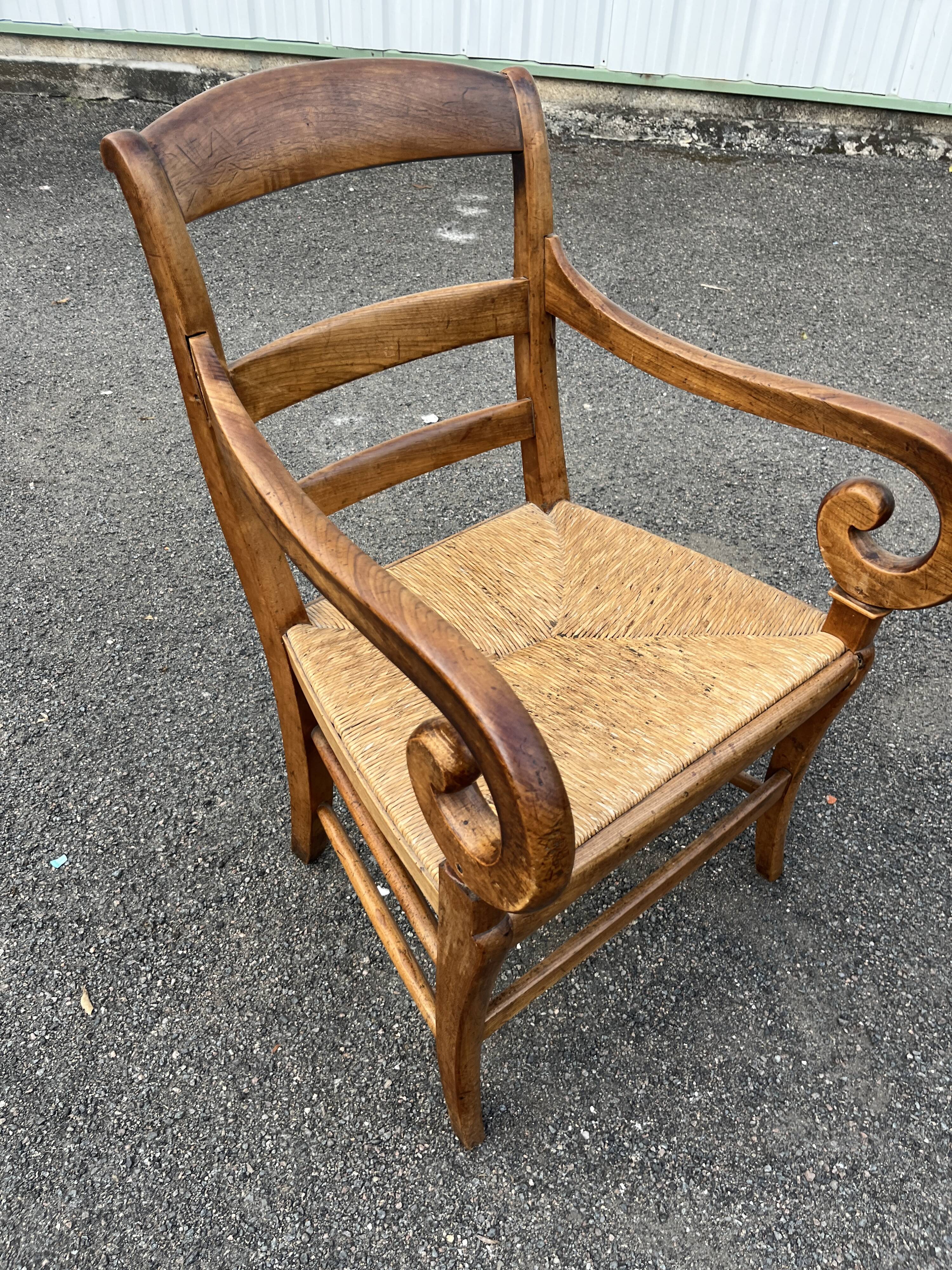 Louis Philippe country armchair in solid wood and straw, hooked armrests